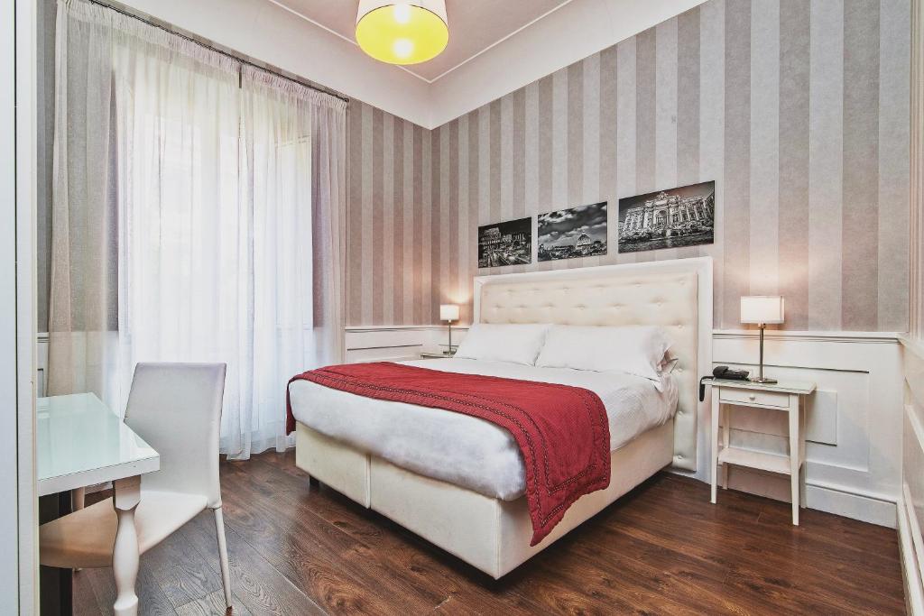 Łóżko lub łóżka w pokoju w obiekcie Star Vatican Rooms