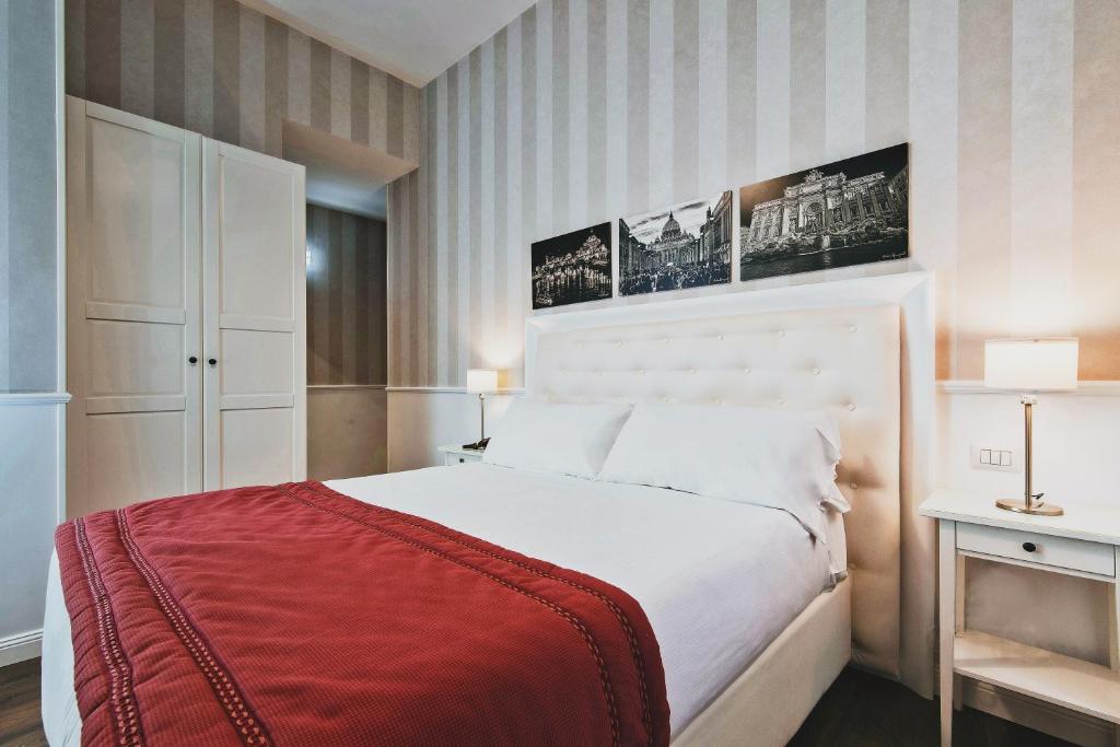 Łóżko lub łóżka w pokoju w obiekcie Star Vatican Rooms