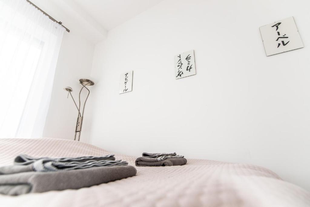 Postel nebo postele na pokoji v ubytování Vinorell Apartman