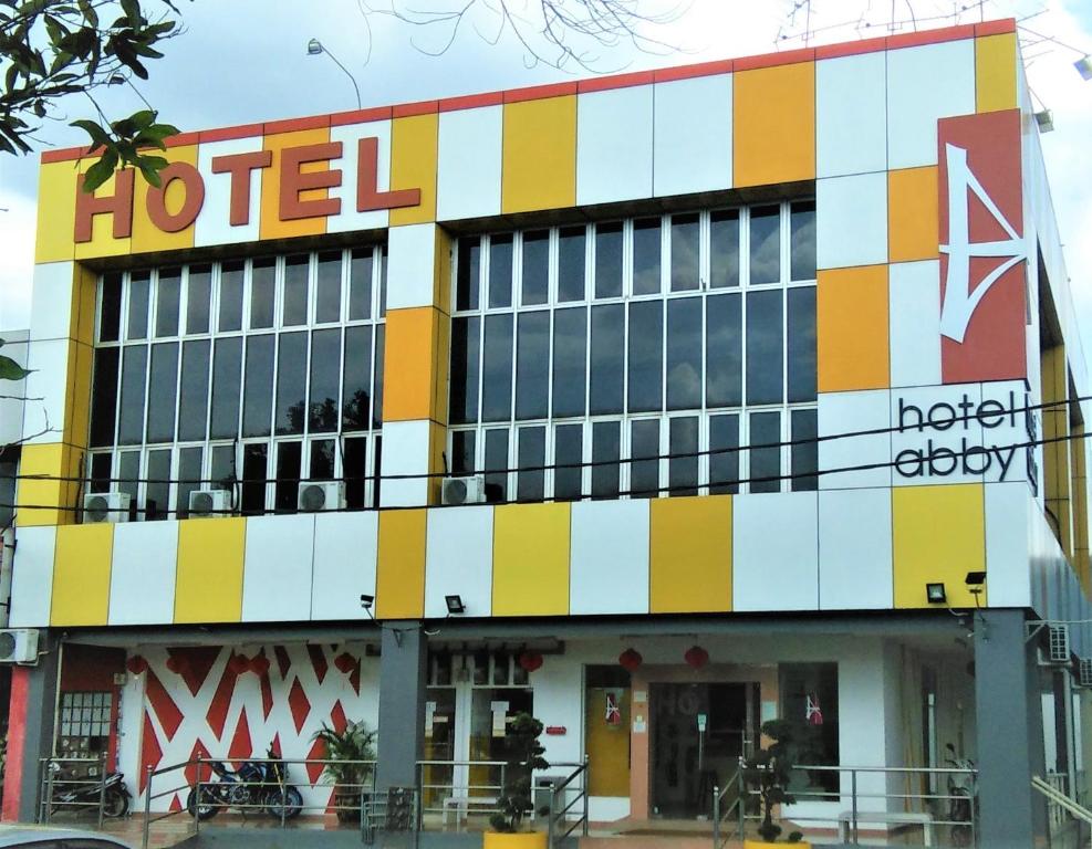 a building with a hotel sign on top of it at Hotel Abby IGB Tasek in Ipoh