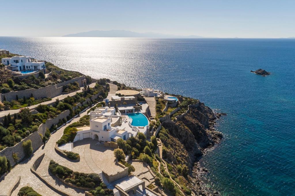 an aerial view of a resort and the ocean at AGL Luxury Villas in Mýkonos City
