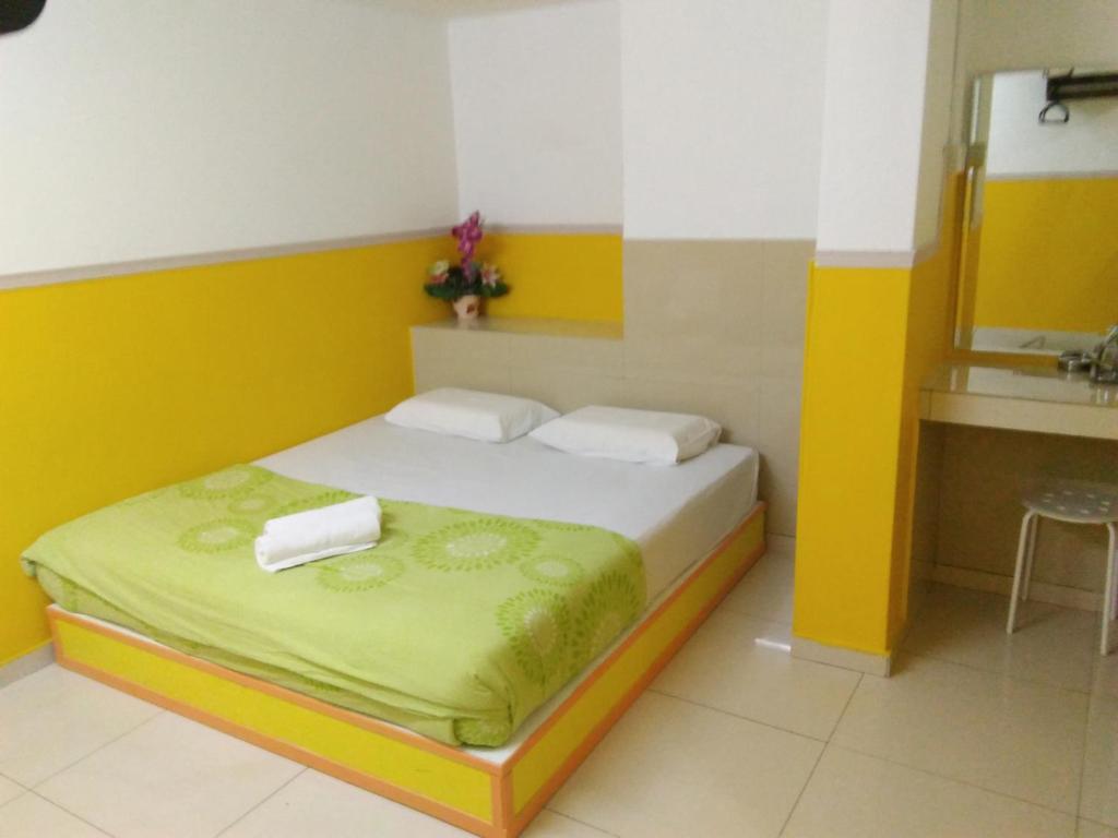 Postel nebo postele na pokoji v ubytování Hotel Abby IGB Tasek