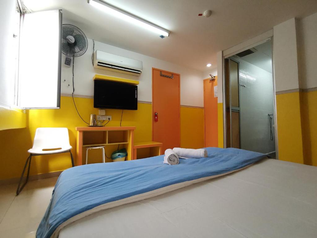 Postel nebo postele na pokoji v ubytování Hotel Abby IGB Tasek