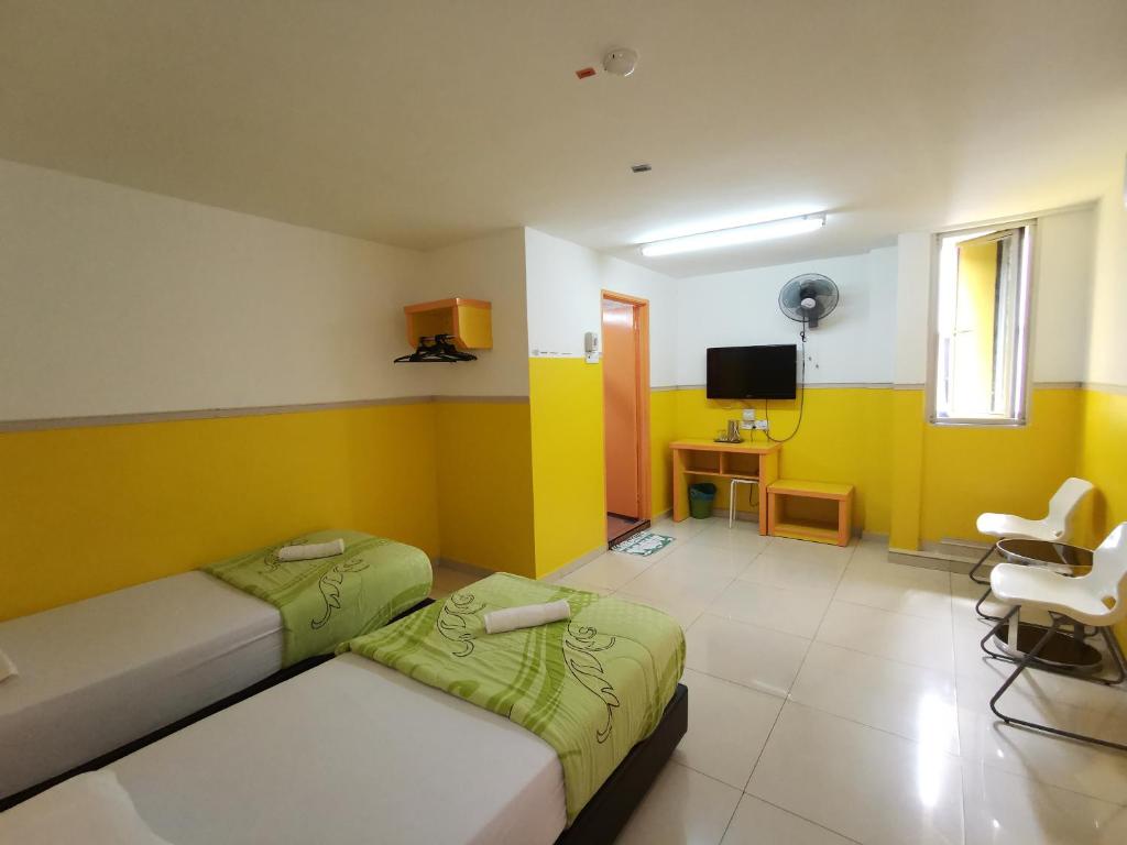 TV a/nebo společenská místnost v ubytování Hotel Abby IGB Tasek