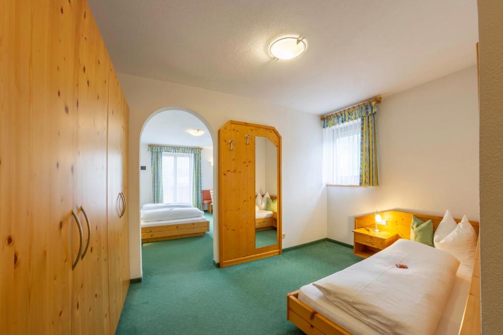Posteľ alebo postele v izbe v ubytovaní Hotel Garni Angerer