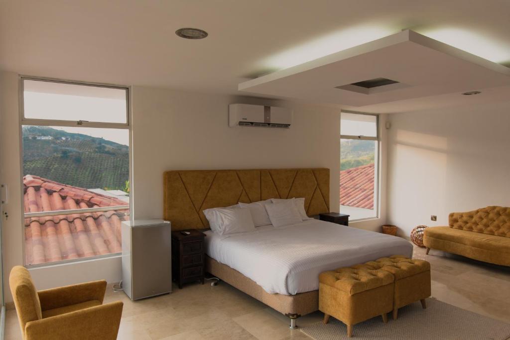 Una cama o camas en una habitación de Hotel Resort Del Cafe