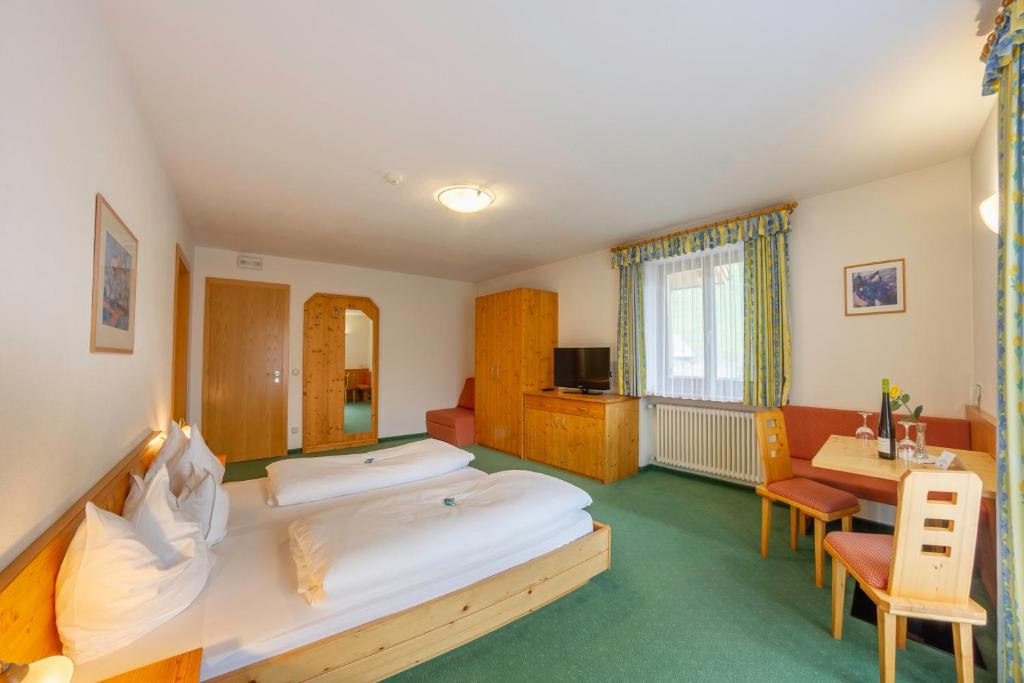 Posteľ alebo postele v izbe v ubytovaní Hotel Garni Angerer