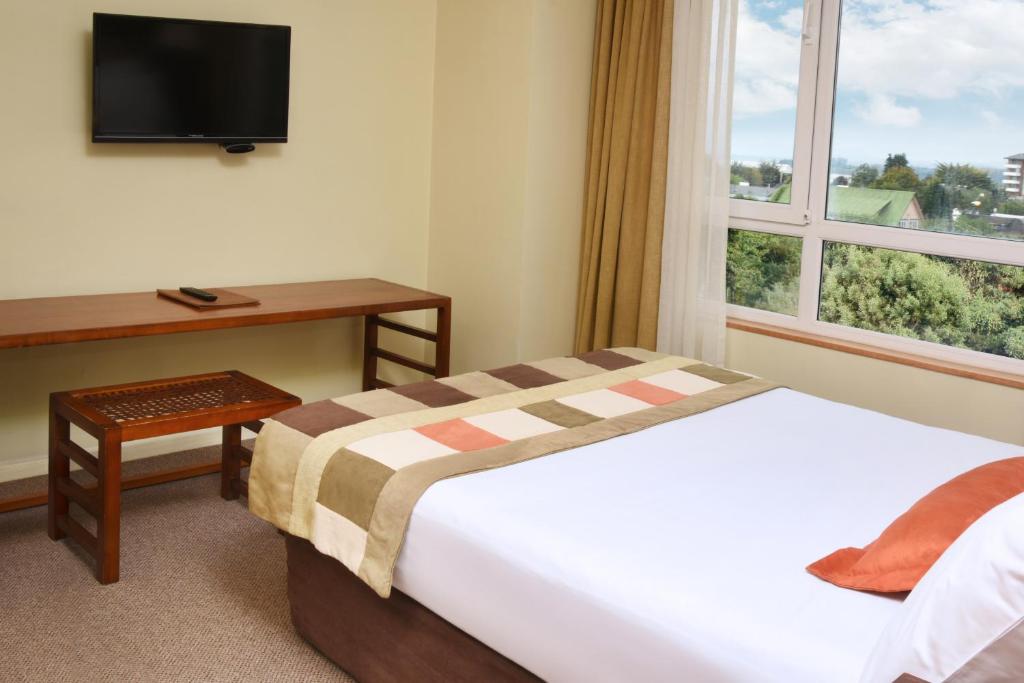 Postel nebo postele na pokoji v ubytování Solace Hotel Puerto Varas