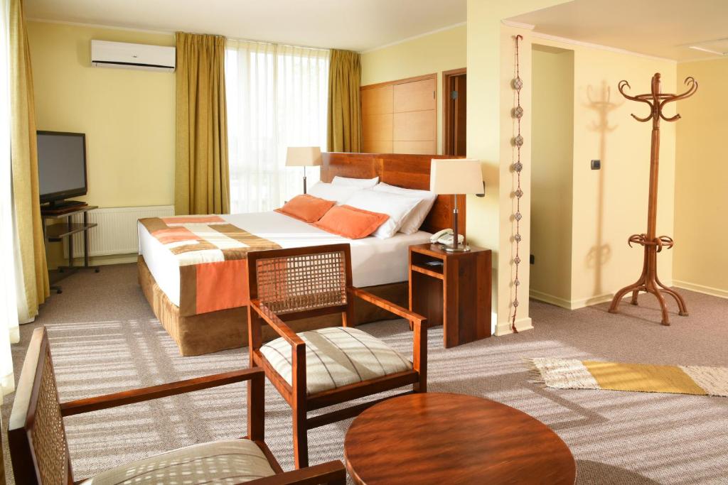 Postel nebo postele na pokoji v ubytování Solace Hotel Puerto Varas