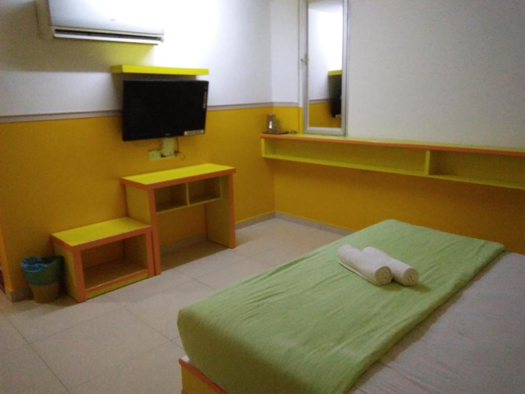 TV a/nebo společenská místnost v ubytování Hotel Abby IGB Tasek