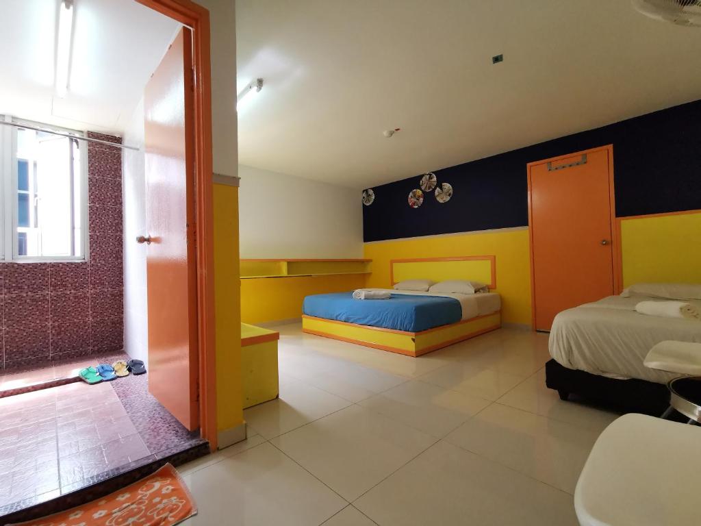 Postel nebo postele na pokoji v ubytování Hotel Abby IGB Tasek
