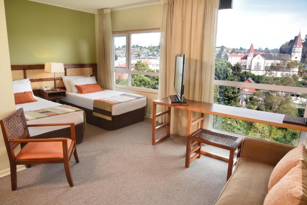 Postel nebo postele na pokoji v ubytování Solace Hotel Puerto Varas