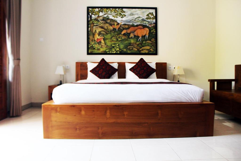 Postel nebo postele na pokoji v ubytování Balimas Guest House