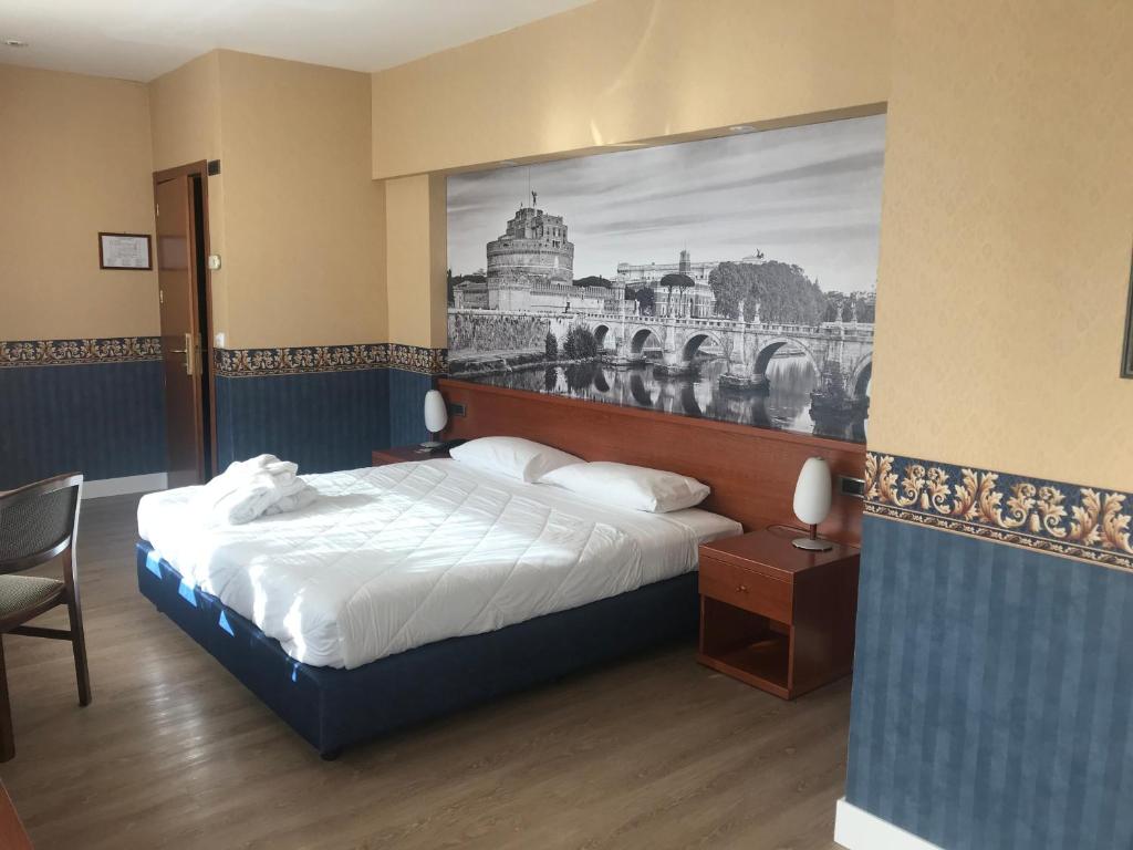 Postel nebo postele na pokoji v ubytování Ele Green Park Hotel Pamphili