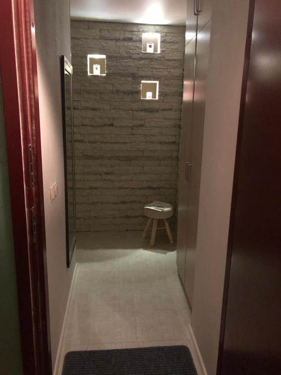 a bathroom with a walk in shower next to a door at Narva mnt 23’’ in Jõhvi