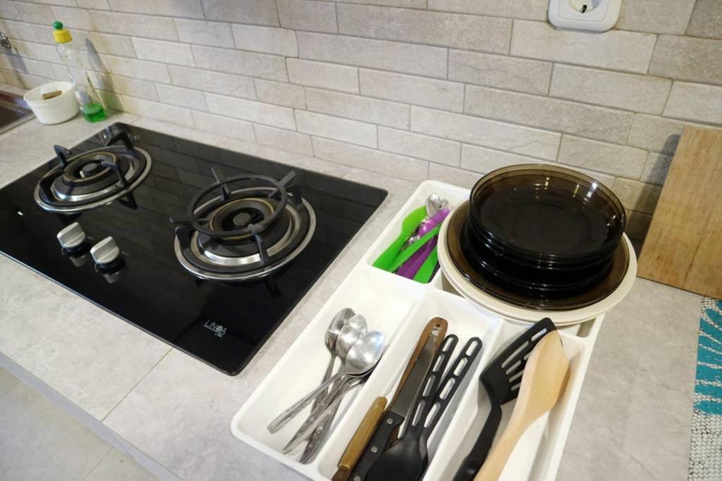 Kuchyň nebo kuchyňský kout v ubytování Minima Residence