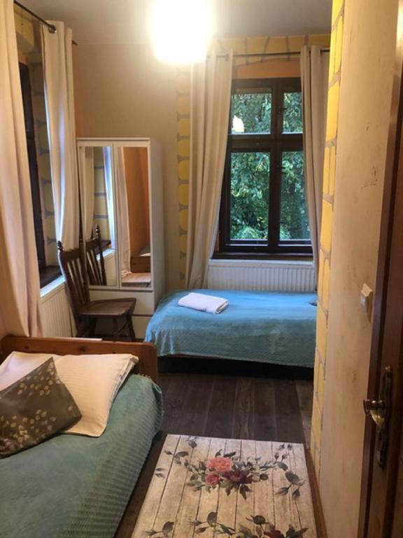 Postel nebo postele na pokoji v ubytování Zacisze Trzech Gór