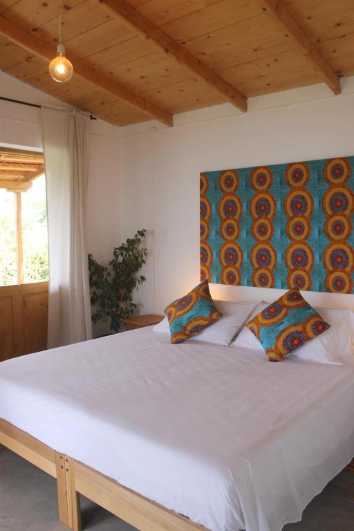 Postel nebo postele na pokoji v ubytování La Fora Ecolodge