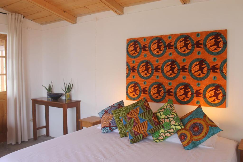 Postel nebo postele na pokoji v ubytování La Fora Ecolodge