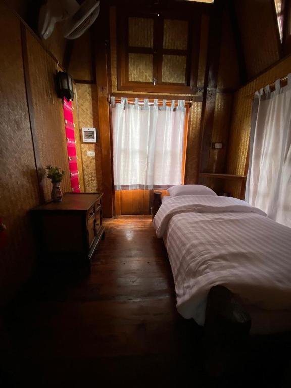 Postel nebo postele na pokoji v ubytování No. 8 Pai