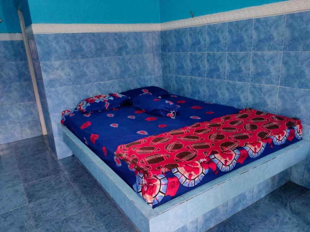 Postel nebo postele na pokoji v ubytování Hotel Abimanyu Bandungan