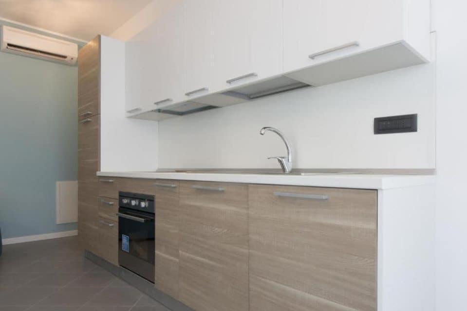a kitchen with a sink and a stove at Panoramic Center Bovisa in Milan