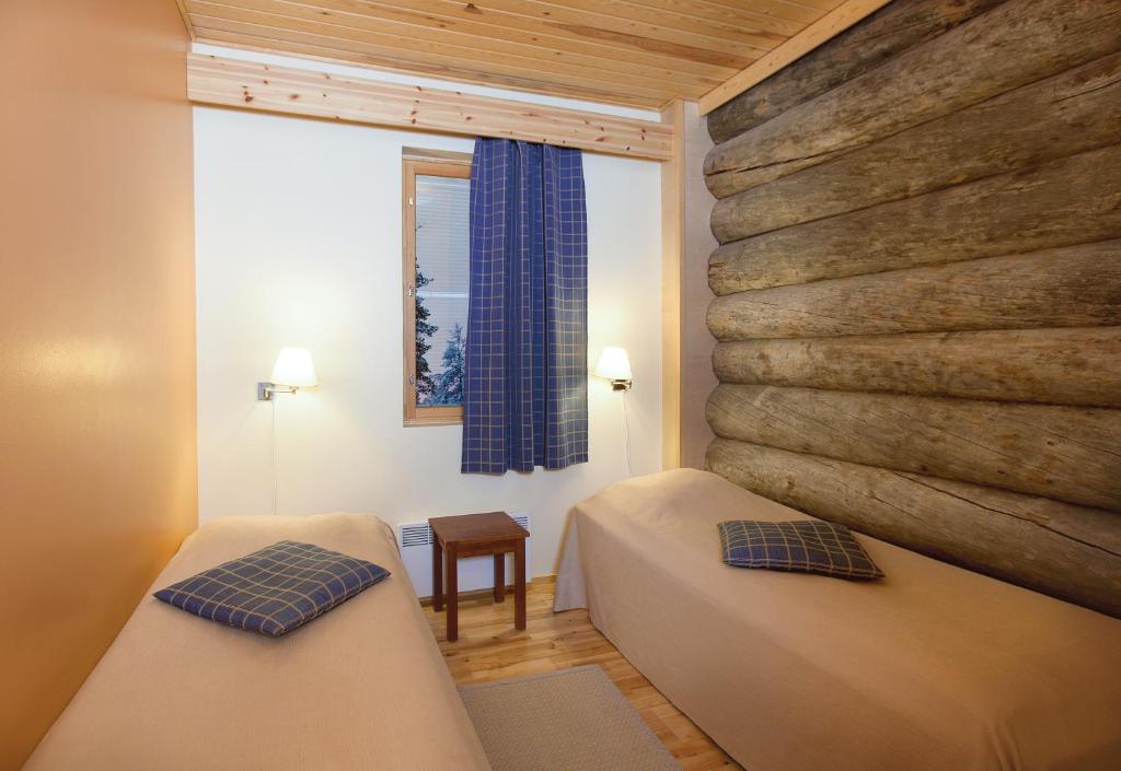 Postel nebo postele na pokoji v ubytování Holiday Club Saariselkä Apartments