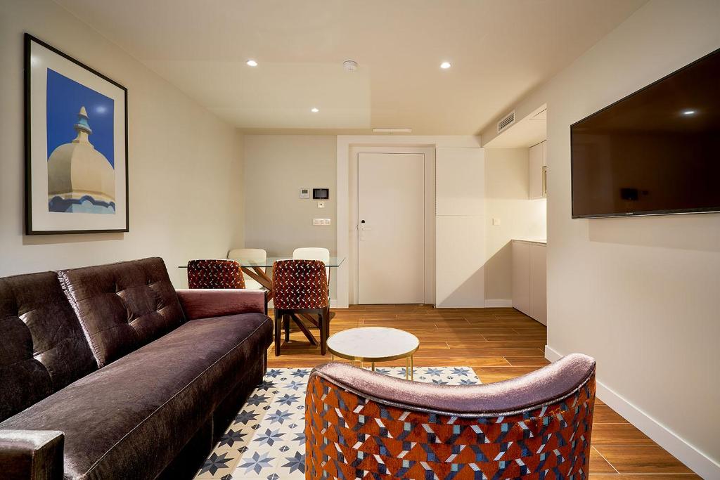 Tandem Torres de Cádiz Suitesにあるテレビまたはエンターテインメントセンター