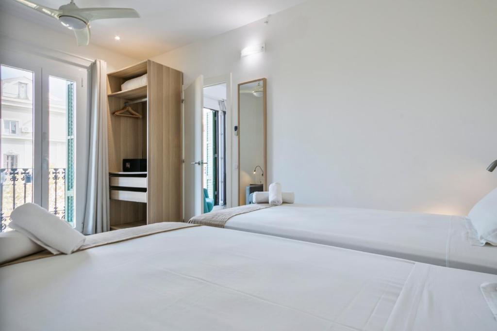 A bed or beds in a room at Stay Together Barcelona Apartments
