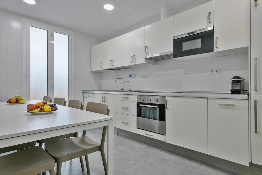 A kitchen or kitchenette at Stay Together Barcelona Apartments