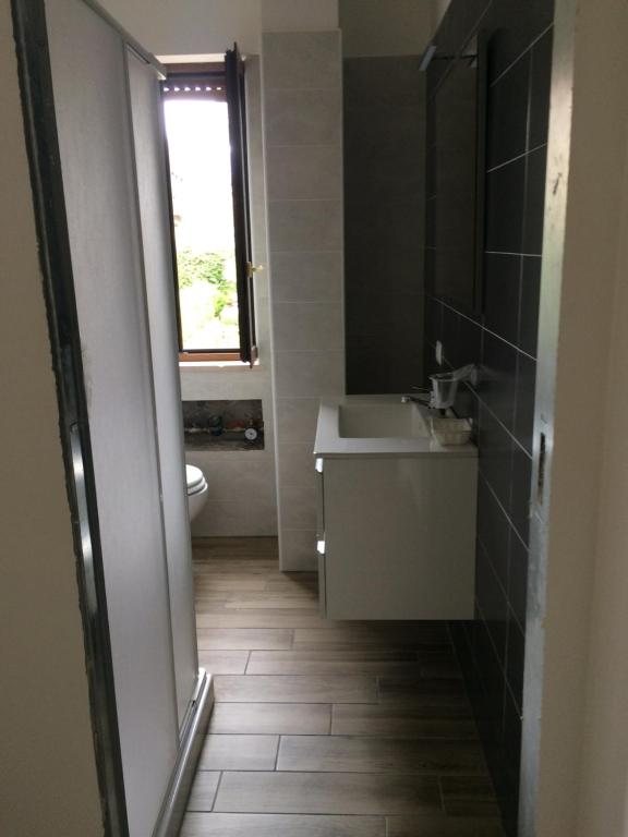 Koupelna v ubytování Caruso Rooms