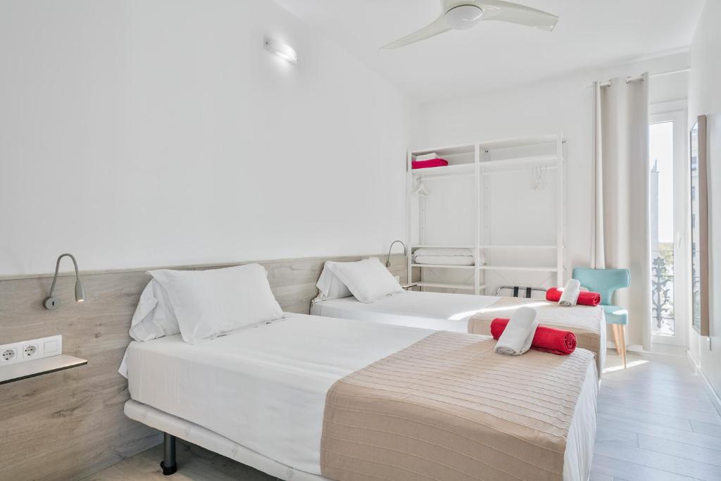 A bed or beds in a room at Stay Together Barcelona Apartments