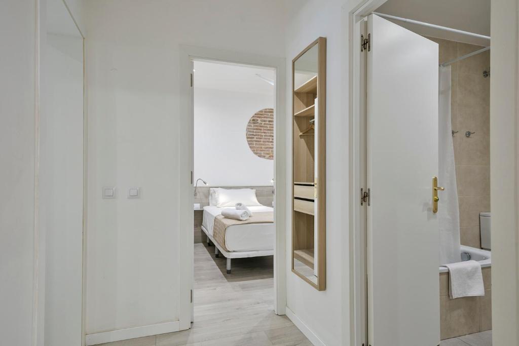 A bed or beds in a room at Stay Together Barcelona Apartments