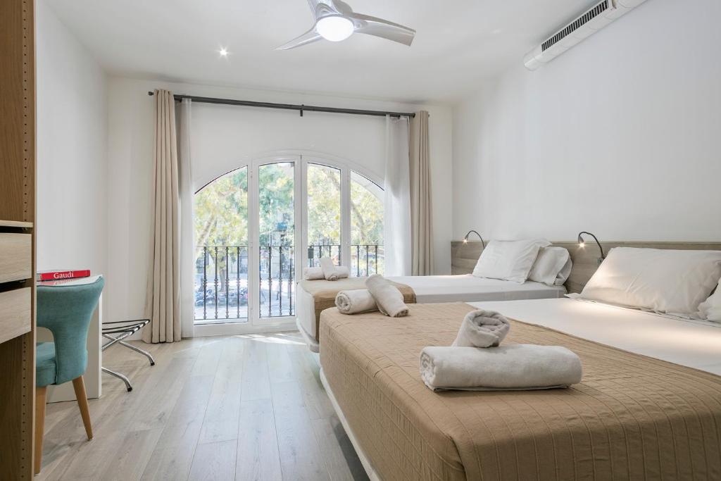 A bed or beds in a room at Stay Together Barcelona Apartments