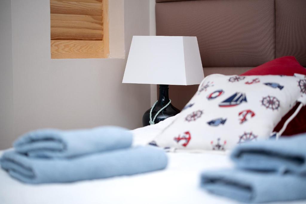 Postel nebo postele na pokoji v ubytování Pokoje Gościnne Tawerna Wejherowo