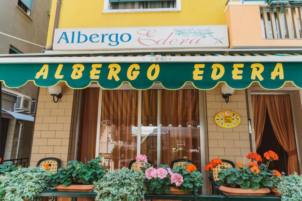a store with a sign for a flower shop at Hotel Edera in Sottomarina