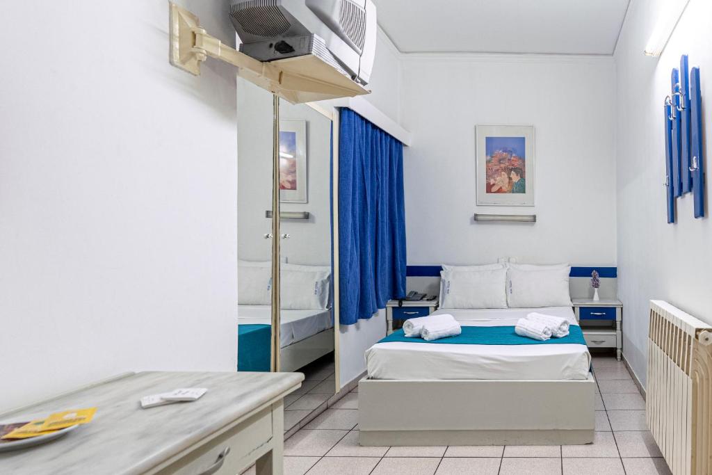 Postel nebo postele na pokoji v ubytování ROY Hotel