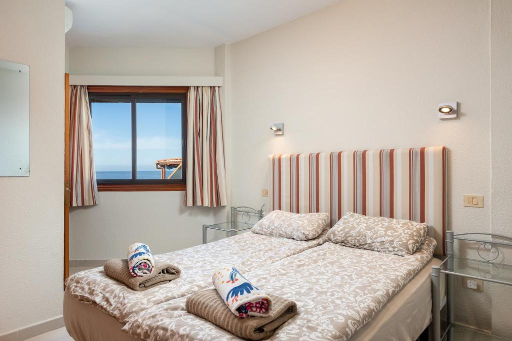 Postel nebo postele na pokoji v ubytování Sunset two bedroom suite