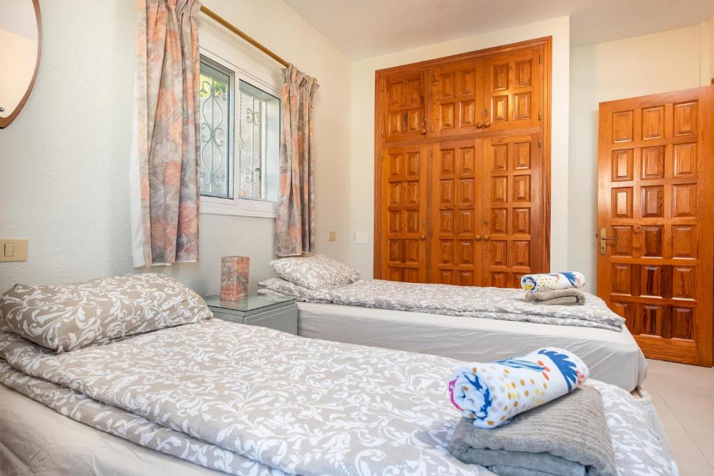 Postel nebo postele na pokoji v ubytování Sunset two bedroom suite