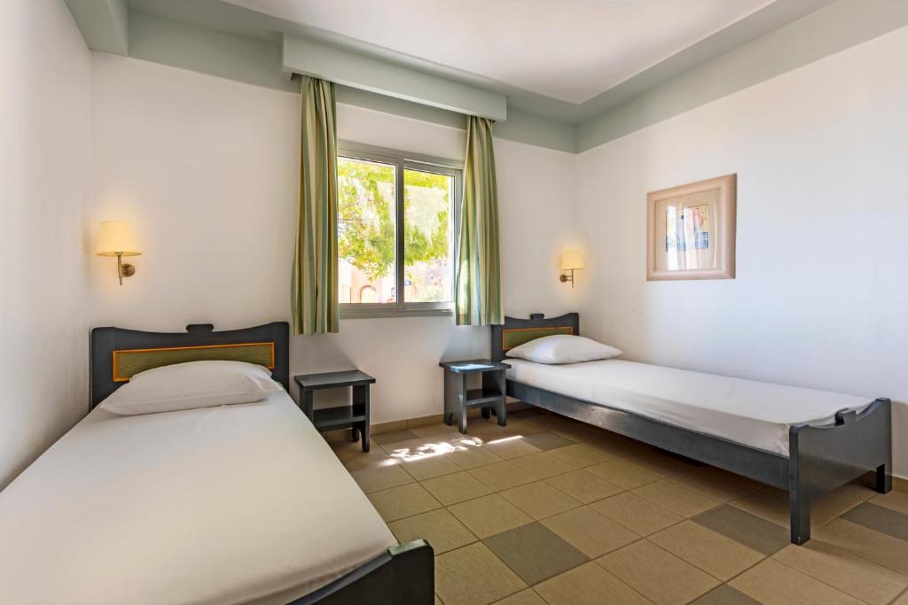 Postel nebo postele na pokoji v ubytování Hapimag Resort Damnoni