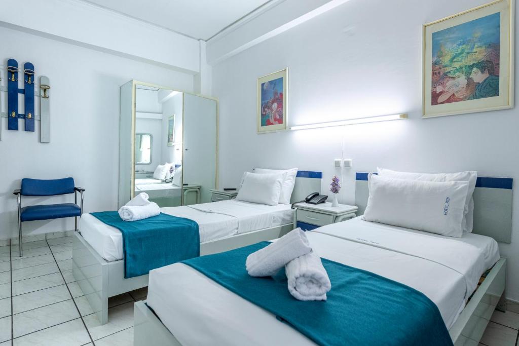 Postel nebo postele na pokoji v ubytování ROY Hotel