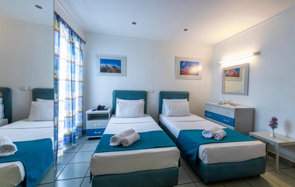 Postel nebo postele na pokoji v ubytování ROY Hotel