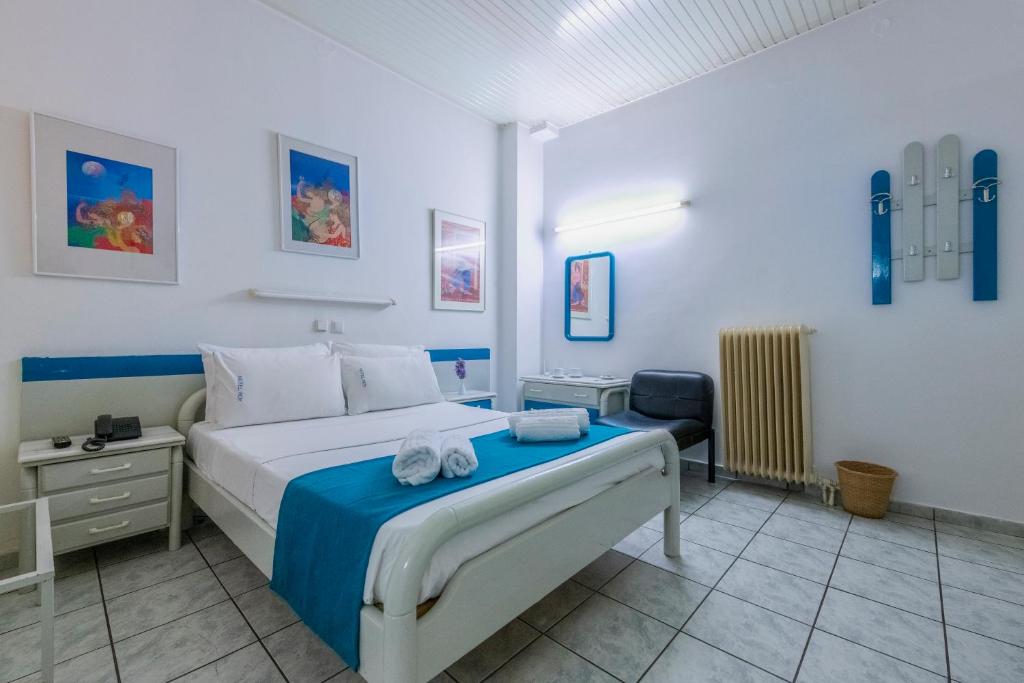 Postel nebo postele na pokoji v ubytování ROY Hotel