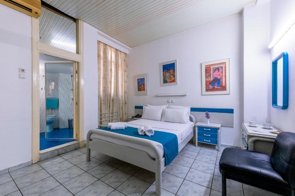 Postel nebo postele na pokoji v ubytování ROY Hotel