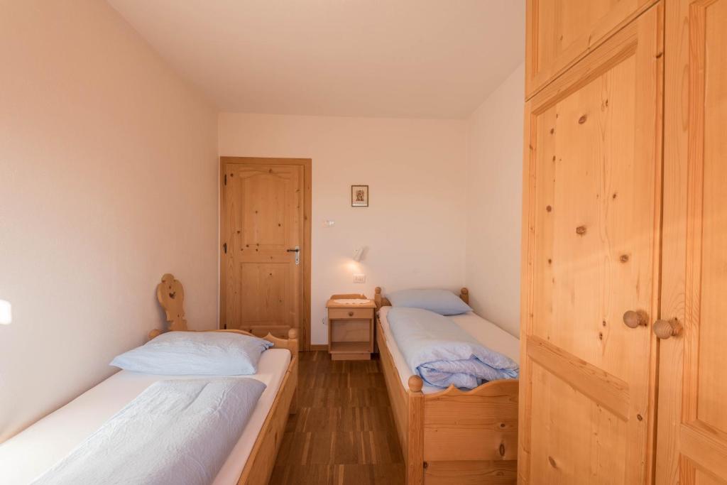 Postel nebo postele na pokoji v ubytování Ferienwohnung Sella Seis