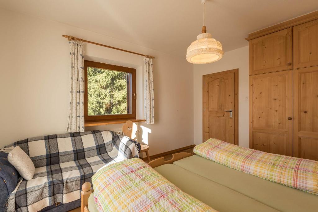 Postel nebo postele na pokoji v ubytování Ferienwohnung Sella Seis
