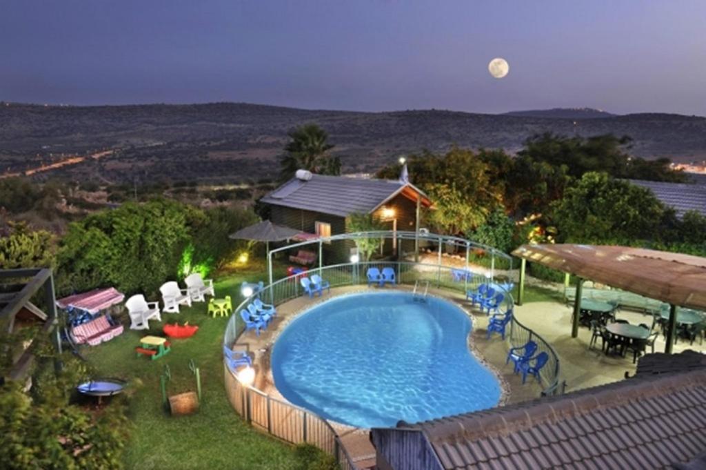an image of a swimming pool on a house at אגם ריזורט בטבע in Kallanit