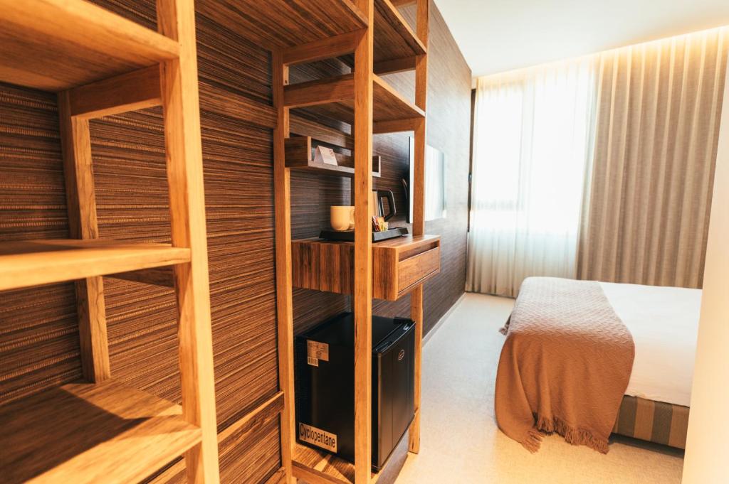 Postel nebo postele na pokoji v ubytování Even Derech by Smart Hotels