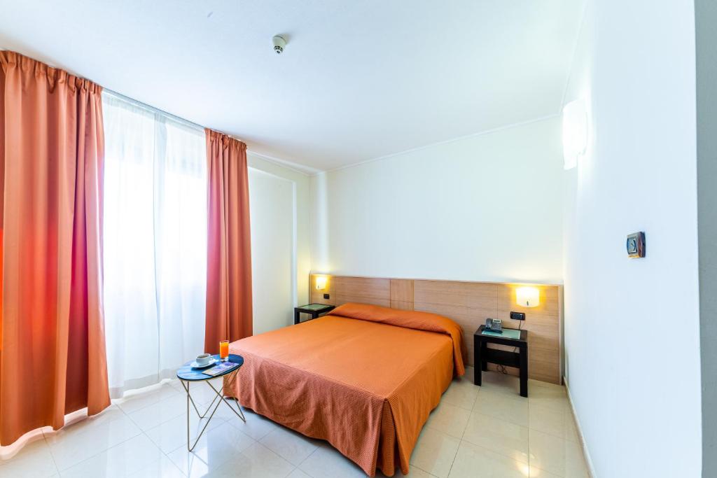 Posteľ alebo postele v izbe v ubytovaní Hotel Le Torri