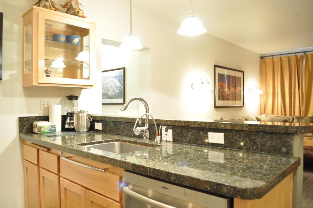 a kitchen with a sink and a counter top at Juniper Springs Lodge # 203 in Mammoth Lakes